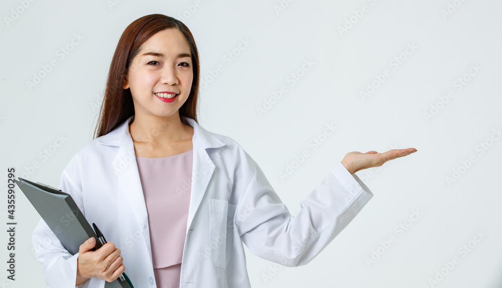 Asian doctor pointing aside in studio Asian doctor pointing aside in studio