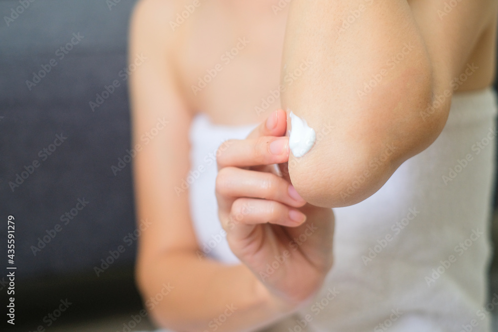 Woman applying cream and lotion on elbow, treatment and cosmetic and cleaning. Woman applying cream and lotion on elbow, treatment and cosmetic and cleaning.