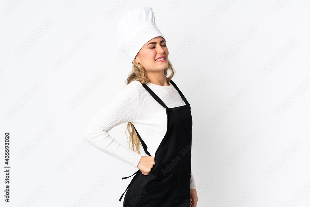 Young Brazilian chef woman isolated on white background suffering from backache for having made an effort Young Brazilian chef woman isolated on white background suffering from backache for having made an effort