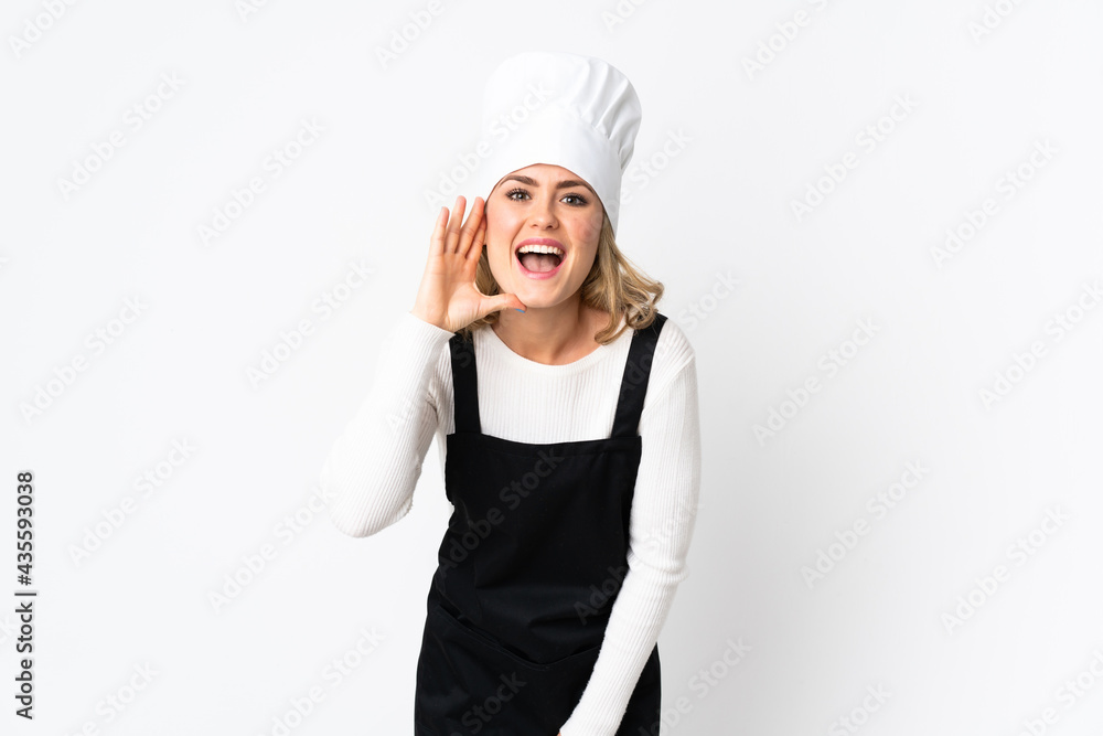 Young Brazilian chef woman isolated on white background shouting with mouth wide open Young Brazilian chef woman isolated on white background shouting with mouth wide open