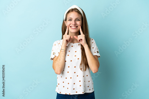 Young caucasian woman over isolated background smiling with a happy and pleasant expression