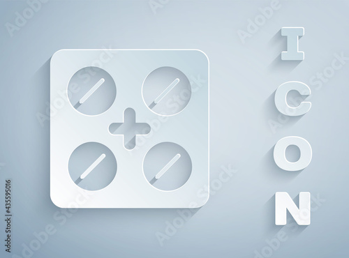 Paper cut Pills in blister pack icon isolated on grey background. Medical drug package for tablet, vitamin, antibiotic, aspirin. Paper art style. Vector