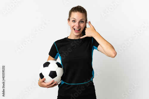 Young football player woman isolated on white background making phone gesture. Call me back sign