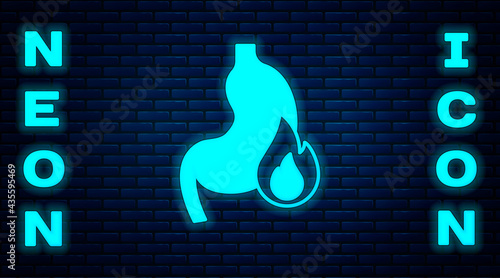 Glowing neon Stomach heartburn icon isolated on brick wall background. Stomach burn. Gastritis and acid reflux, indigestion and stomach pain problems. Vector