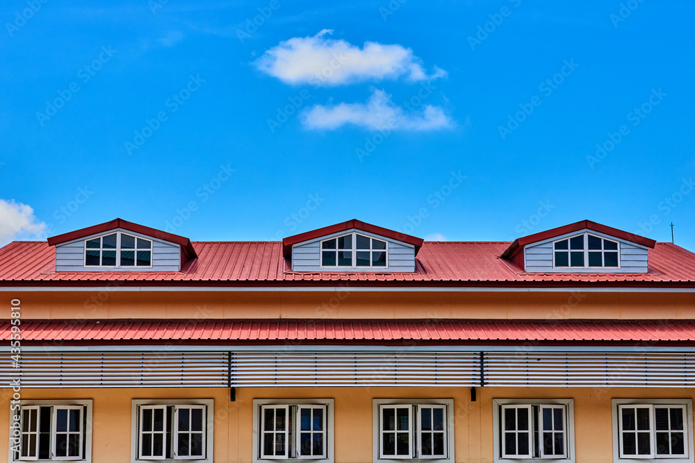 fluffy clouds with blue sky over the roof top building fluffy clouds with blue sky over the roof top building