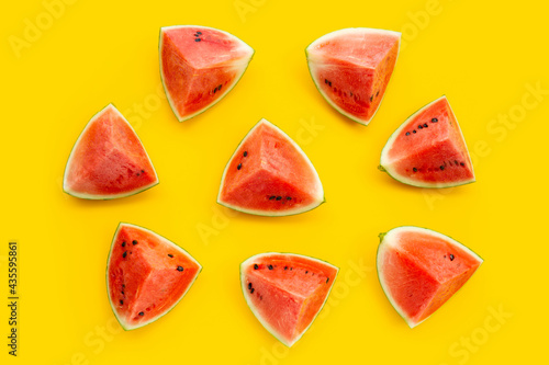 Fototapeta Naklejka Na Ścianę i Meble -  Watermelon on yellow surface. Top view