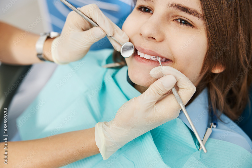 Happy kid is liking his dental examination Happy kid is liking his dental examination
