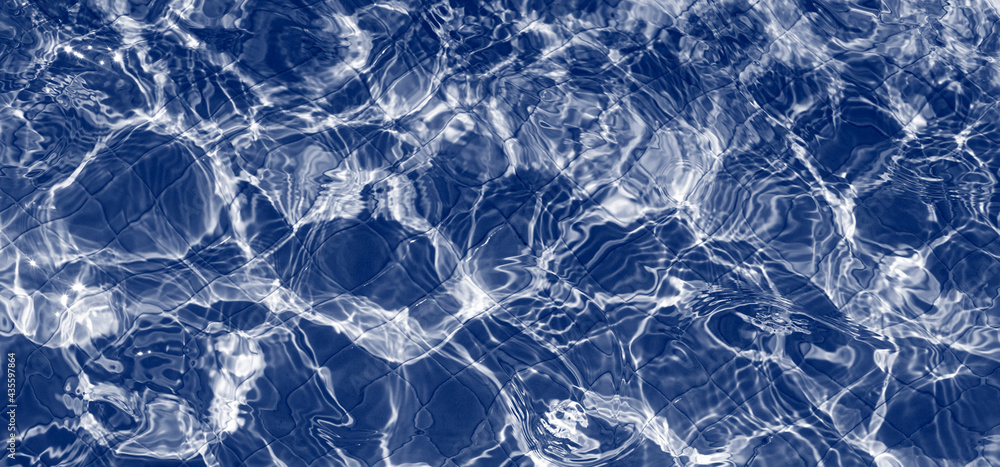Water in swimming pool with sun reflection Water in swimming pool with sun reflection