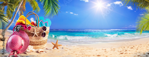 Beach Bag On Tropical Sand With Palm tree and Sunny Sea