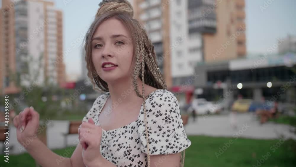 Happy Girl with dreadlocks dancing in the street Happy Girl with dreadlocks dancing in the street