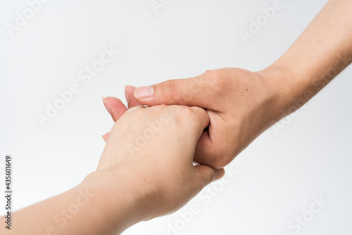 Close up of handshake on white background