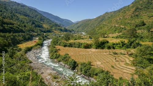Fototapeta Naklejka Na Ścianę i Meble -  Rural landscape panorama in the picturesque valley of Gamri Chu river with rice fields and forest, Trashigang, eastern Bhutan








