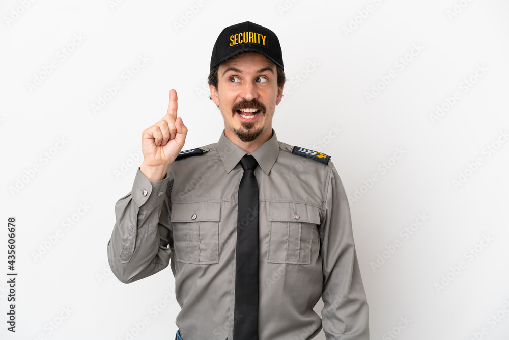Young caucasian security man isolated on white background intending to realizes the solution while lifting a finger up Young caucasian security man isolated on white background intending to realizes the solution while lifting a finger up
