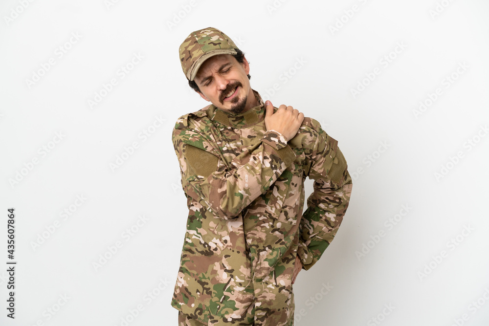 Soldier man isolated on white background suffering from pain in shoulder for having made an effort Soldier man isolated on white background suffering from pain in shoulder for having made an effort