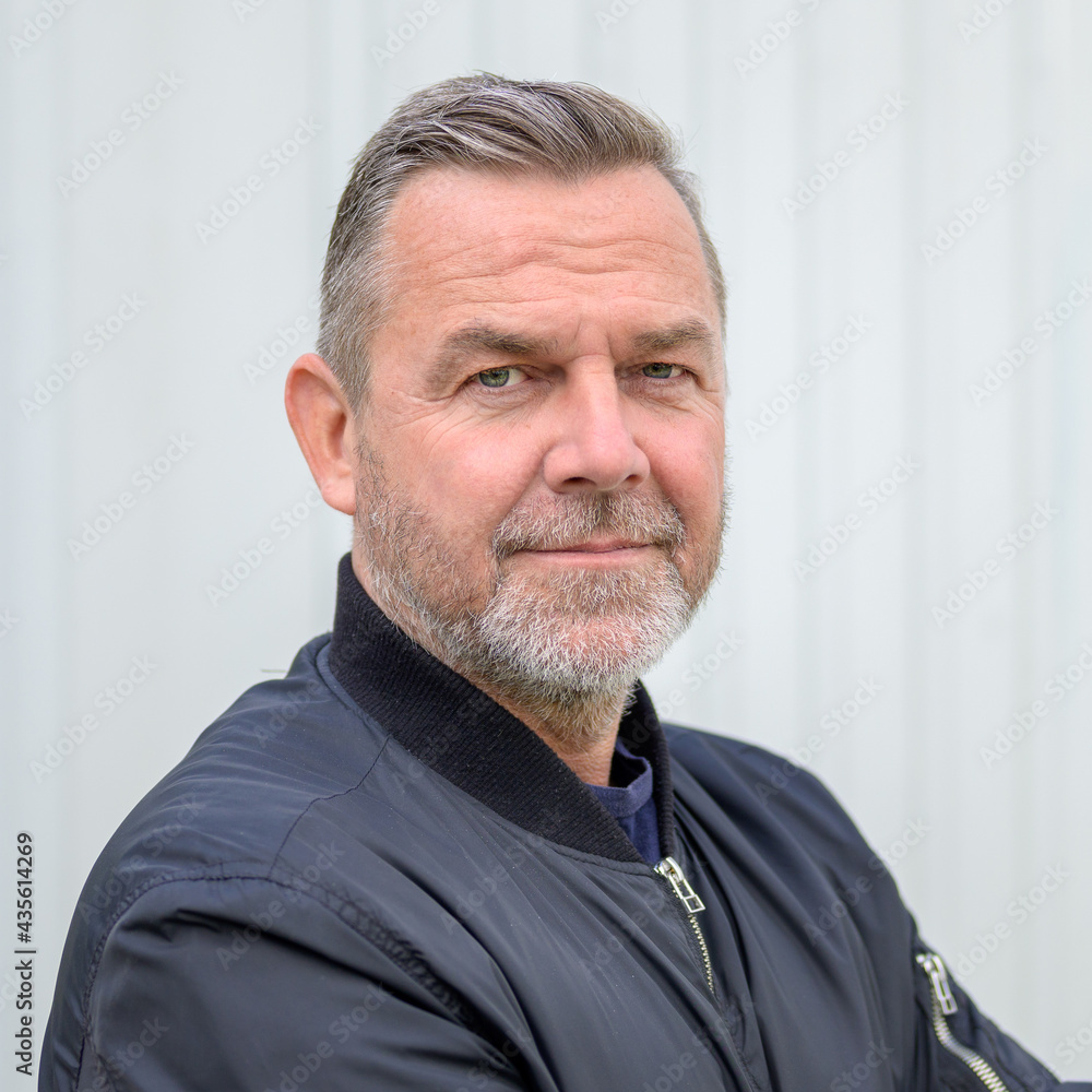 Serious middle-aged man looking pensively at the camera Serious middle-aged man looking pensively at the camera