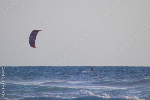 Kitesurfing surfer on the beach in Tel Aviv