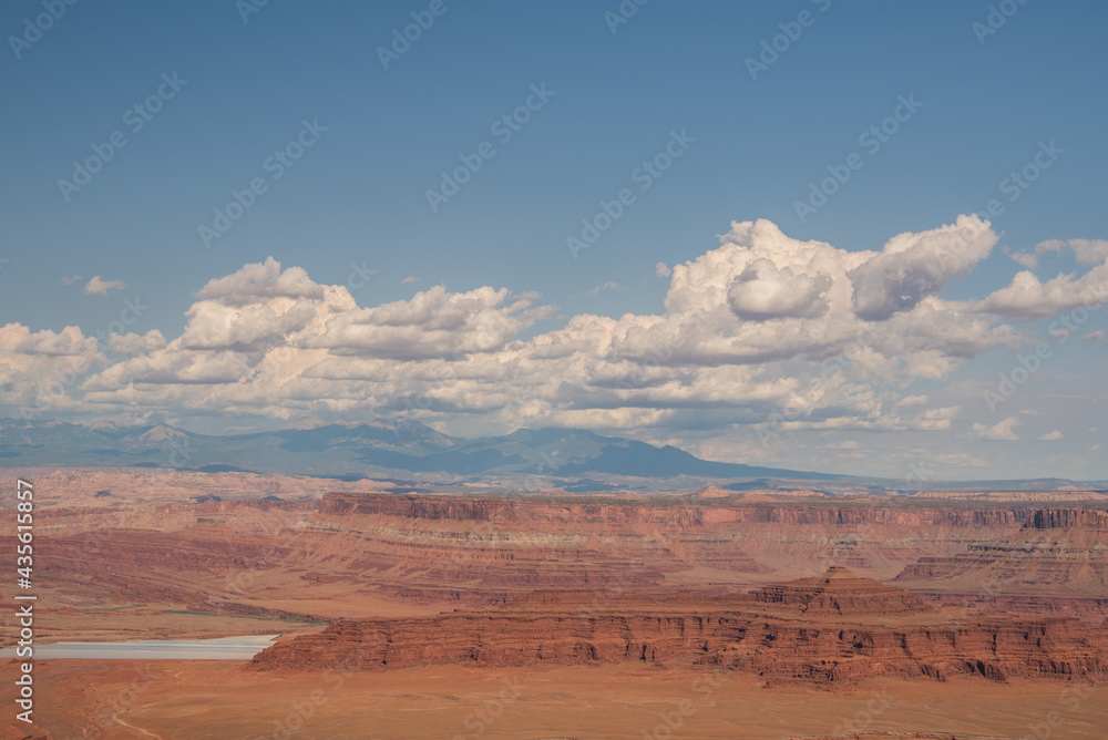 Naklejka premium Vast view of Canyonlands National Park with gorgeous sky and layers of red rock canyon.