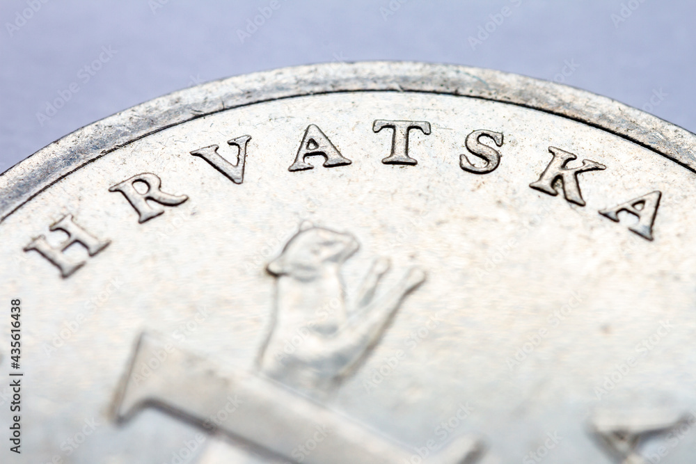 A fragment of croatian metal coin macro photo A fragment of croatian metal coin macro photo