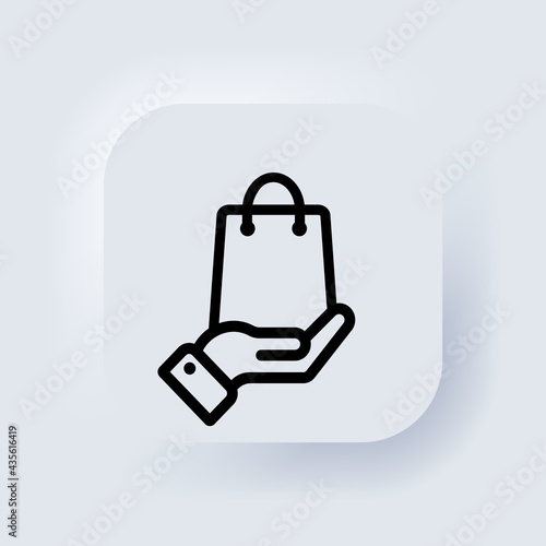 Hand holding paper bag. Shopping bag icon. Click and collect order online. Vector. Purchase business concept. Neumorphic UI UX white user interface web button. Neumorphism. Vector