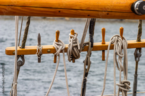 Belaying pin with ropes on a ship photo