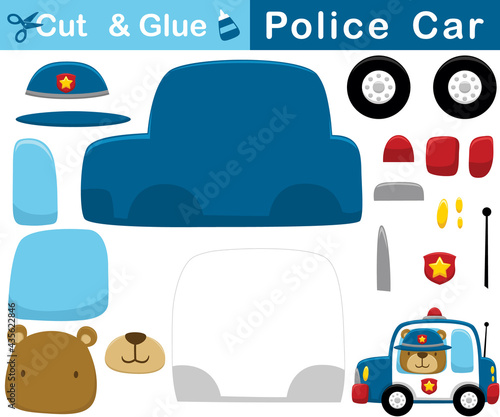 Cartoon of funny bear wearing police cap on police car. Education paper game for children. Cutout and gluing