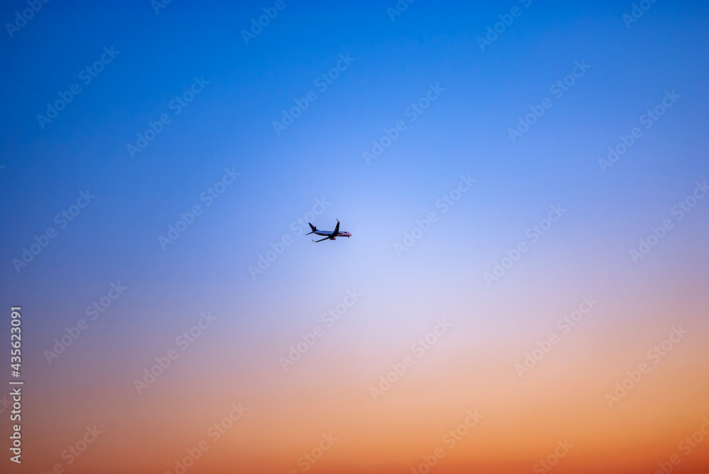 Fototapeta premium Sunset and airplane