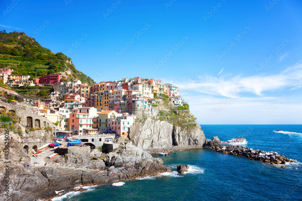 Manarola village on cliff rocks and sea at sunset., Seascape in Five lands, Cinque Terre National Park, Liguria Italy Europe