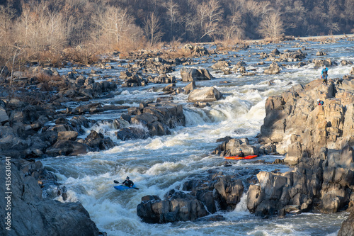 Kayakers thread their way down a series of challenging drops that make up Great Falls of the Potomac River, Virginia