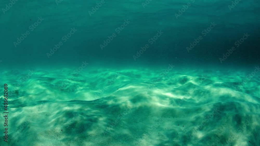 Close-Up Beautiful Shot Of Sand Below Turquoise Sea - Big Island, Hawaii Close-Up Beautiful Shot Of Sand Below Turquoise Sea - Big Island, Hawaii