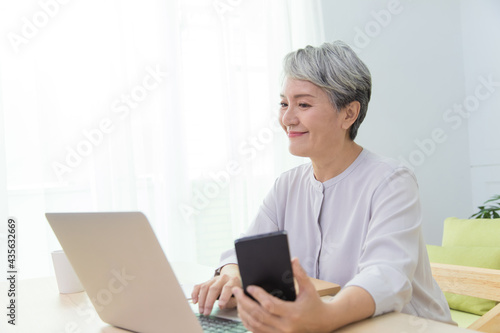 Senior Asia woman is working from home