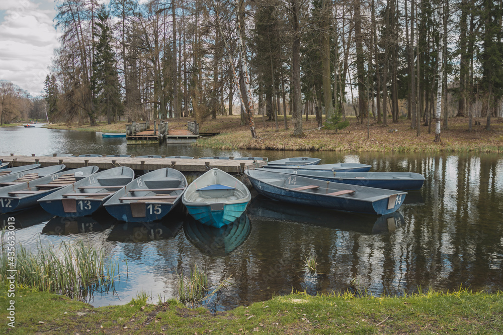 Blue boats on the river bank in Gatchina park Blue boats on the river bank in Gatchina park