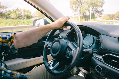 man hands on steering wheel © phpetrunina14