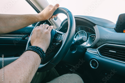 man hands on steering wheel © phpetrunina14