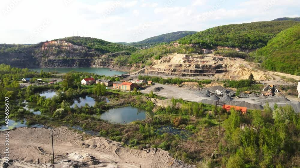Aerial Flight over the quarry of sand and stone. An existing quarry where minerals are mined. Aerial Flight over the quarry of sand and stone. An existing quarry where minerals are mined.