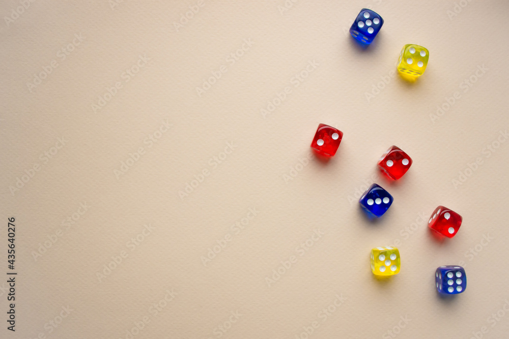 dice red and blue and yellow color light background dice red and blue and yellow color light background