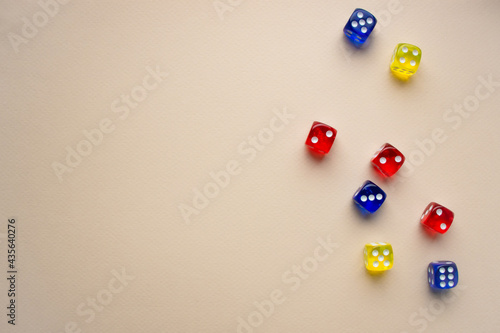 dice red and blue and yellow color light background