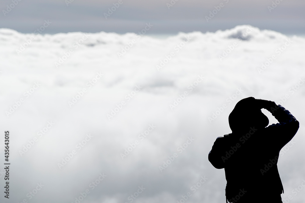 Men's silhouette photographed the morning mist Men's silhouette photographed the morning mist
