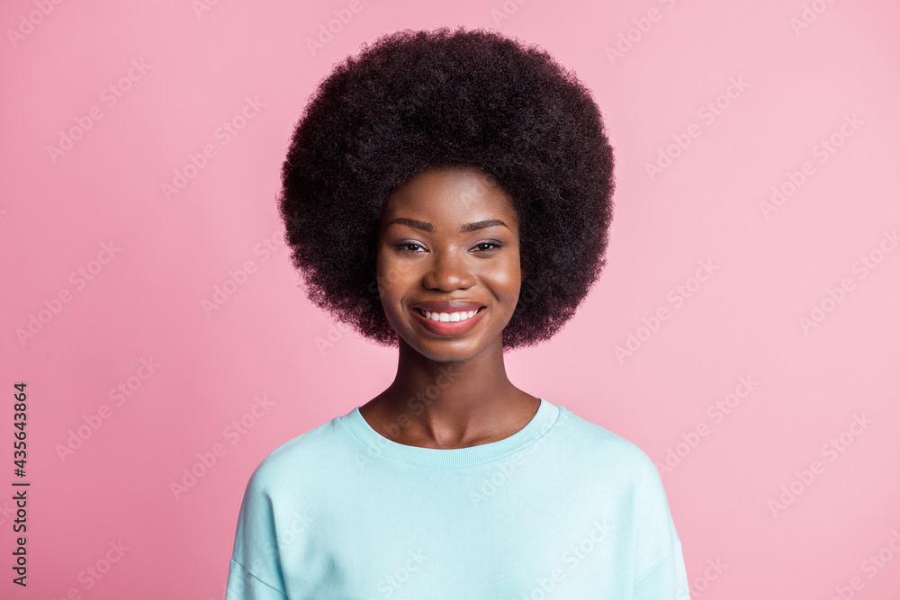 Photo of dark skin charming woman good mood smile wear teal pullover isolated on pastel pink color background Photo of dark skin charming woman good mood smile wear teal pullover isolated on pastel pink color background