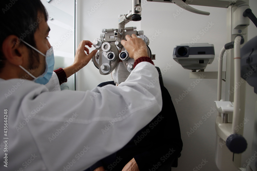 Checking the eyes in an optical shop Checking the eyes in an optical shop