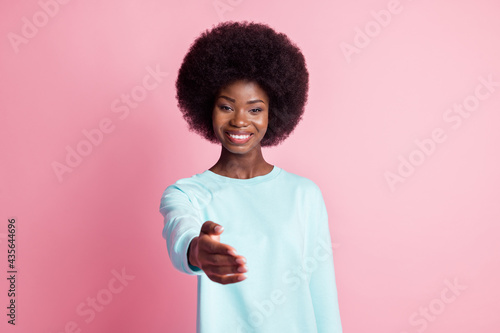 Photo portrait of girl meeting friend greeting hand palm isolated on pastel pink color background