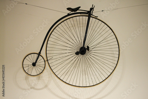 Penny-farthing / vintage bicycle on a wall photo