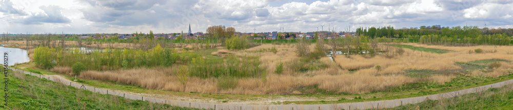 Panorama of a polder landscape near Kruibeke with the village in the background