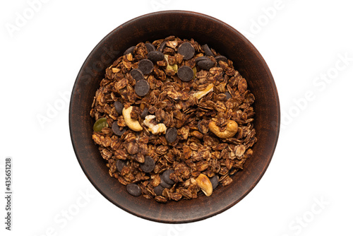 Chocolate granola cereal with nuts in a bowl background.