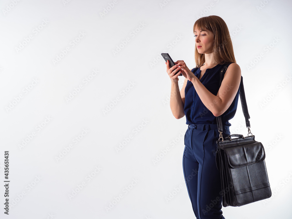 Woman smartphone on white background. Girl with a phone and a business briefcase. A businesswoman is using an application on her phone. Using chat applications or SMS messages. Woman phone. Woman smartphone on white background. Girl with a phone and a business briefcase. A businesswoman is using an application on her phone. Using chat applications or SMS messages. Woman phone.