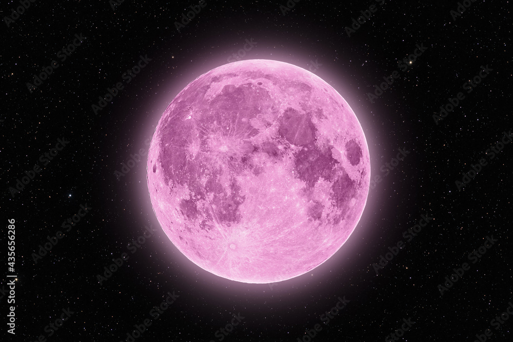 Full pink supermoon halo glowing surrounded by stars on black night sky background