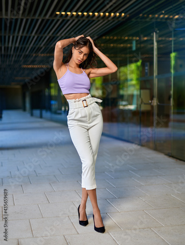 Portrait of young woman at outdoors.