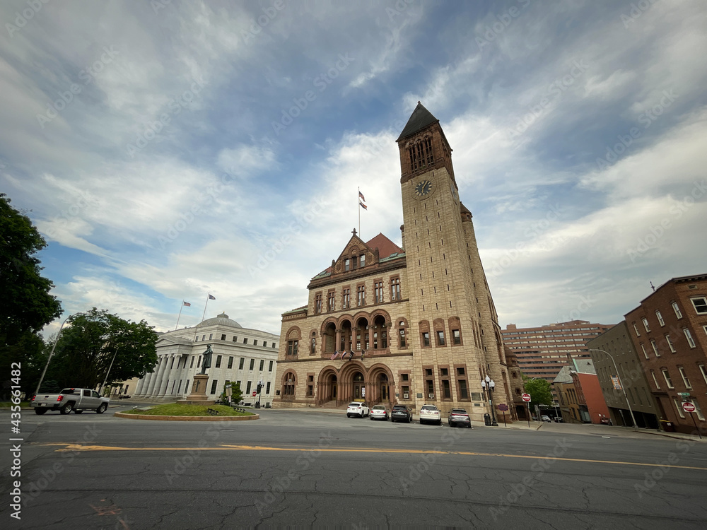 Albany, NY - USA - May 22, 2021: A view of the historic Richardsonian Romanesque Albany City Hall, the seat of government of the city of Albany, New York. Featuring a 202-foot tall tower.