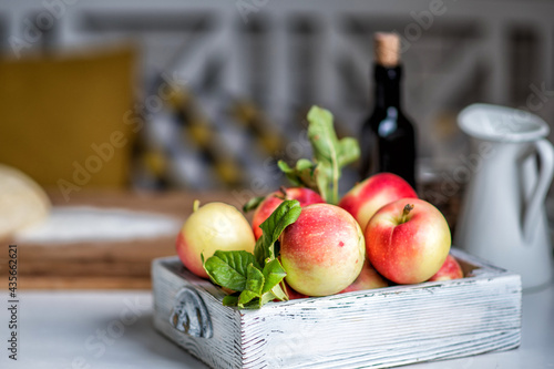Ripe red apples in wooden box. Space for your text.