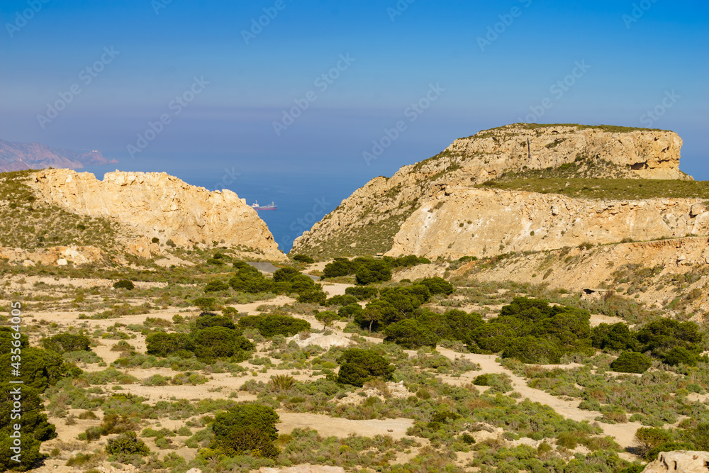Rocky coast Landscape with ship on sea, Spain