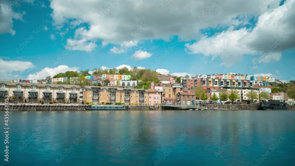 Time lapse of clouds over multi-coloured houses and harbourside in Bristol, UK Time lapse of clouds over multi-coloured houses and harbourside in Bristol, UK